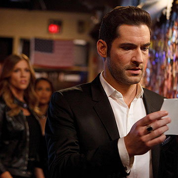 Lucifer and Chloe reviewing evidence